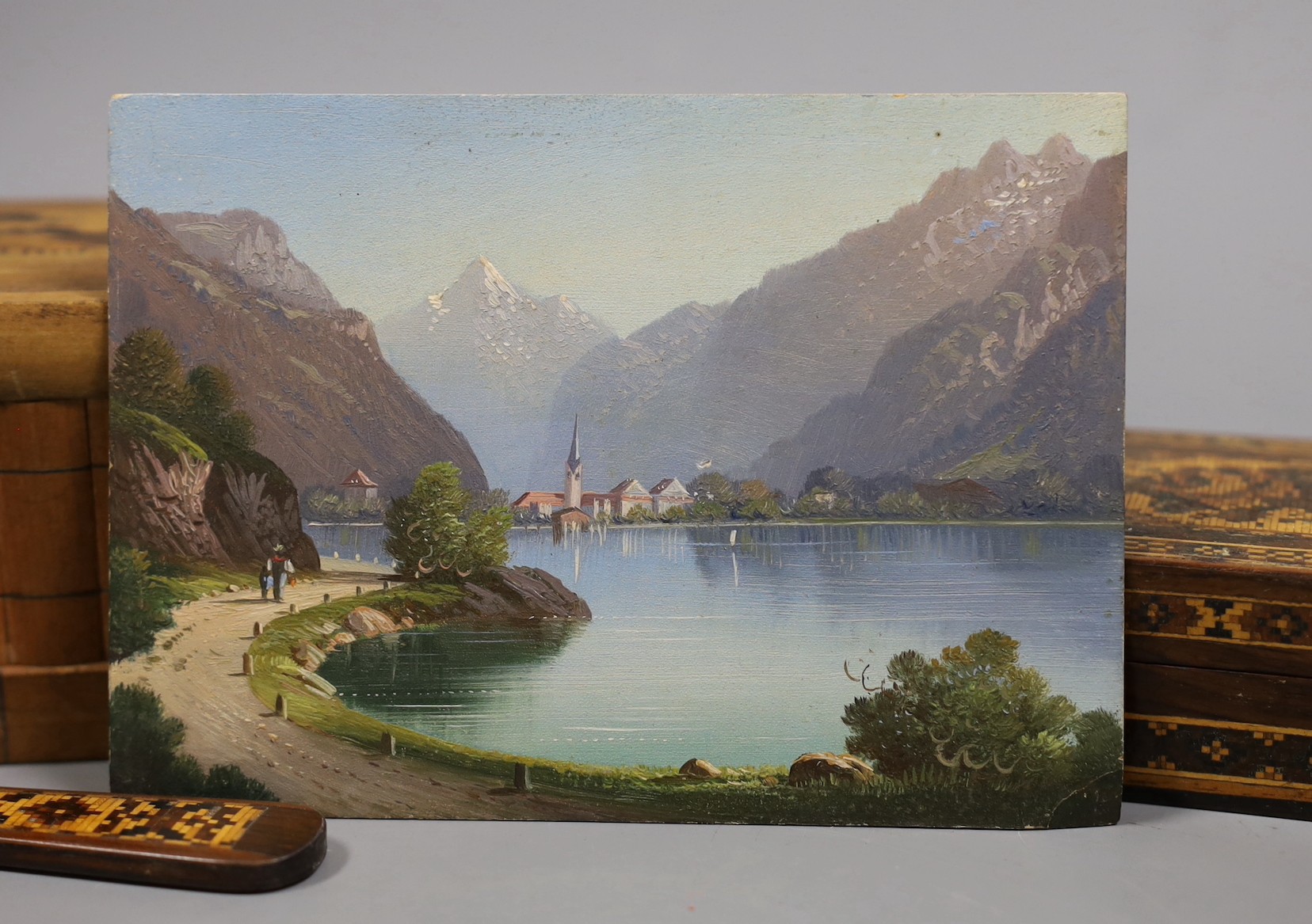 A 19th century Swiss oil on panel, a Tunbridgeware box and paperknife and other wood wares